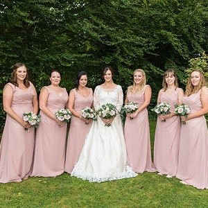 Alysha wearing her Bespoke Wedding Dress with her Bridesmaids all wearing a Custom Made to Measure Bridesmaid Dress called Sienna designed by Ella Rae