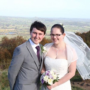 Becky and James wearing a beautiful Bespoke Wedding Dress and Bolero designed by Amelia Gray