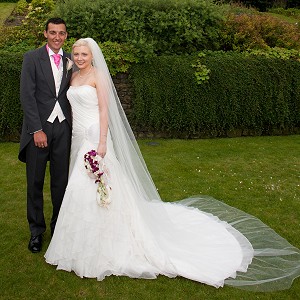 Laura and her Husband on their wedding day resized