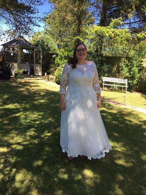 Poppy wearing her Bespoke Amelia Gray Lace Wedding Dress designed by Patricia Barclay